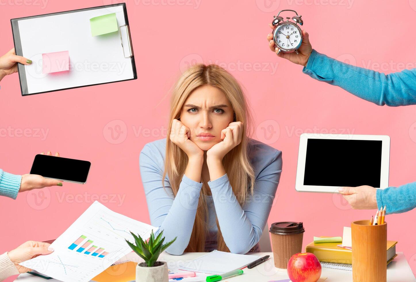 Deadline And Multitask. Tired sad girl stressed by a lot of work, sitting at desk, looking angrily at camera, mock up photo