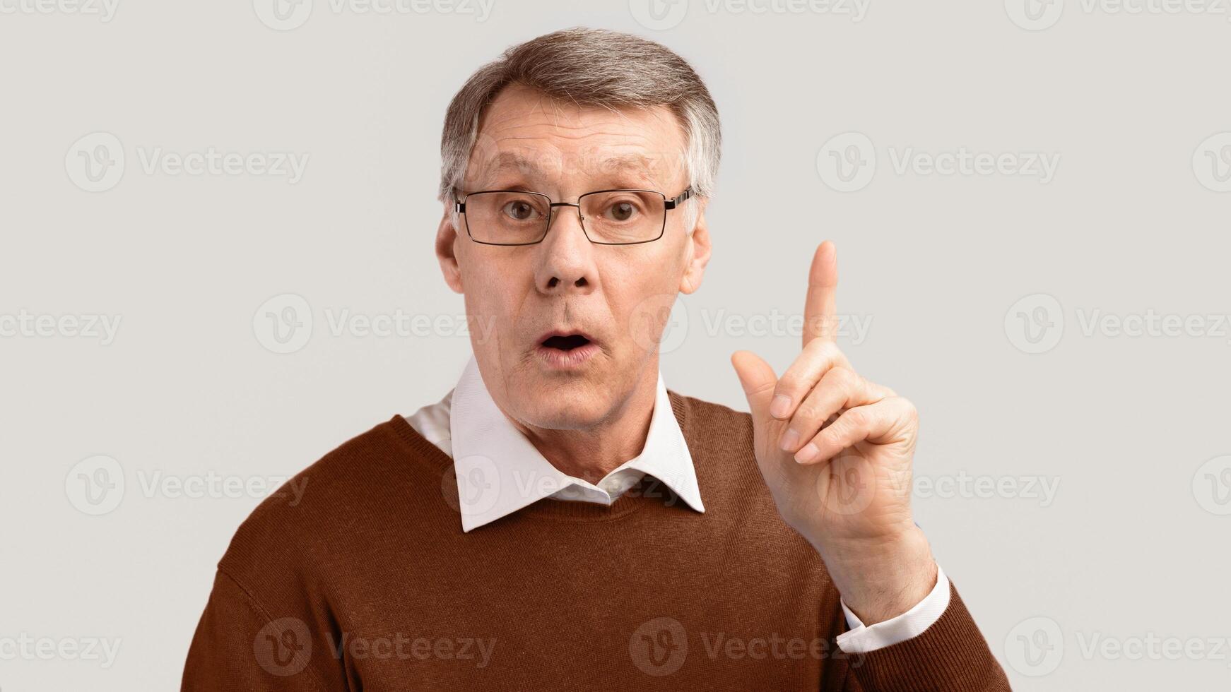 Idea. Elderly Gentleman Having Eureka Moment Pointing Finger Up Posing Over Gray Background. Panorama, Studio Shot photo