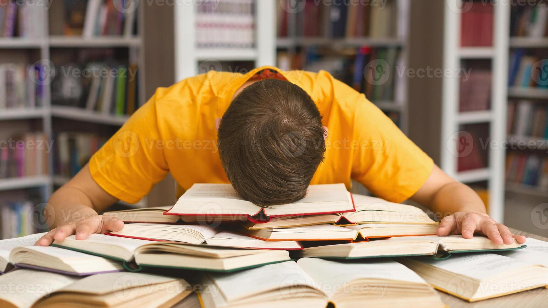 Student studying hard exam and sleeping on books in library, free space photo