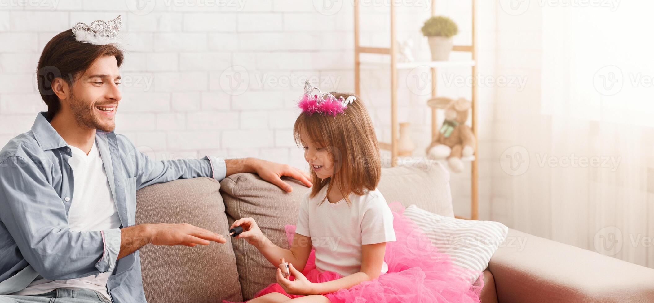 You are my best friend. Little pretty princess coloring her dad nails with polisher, daddy wearing crown, enjoying time with his daughter, free space photo