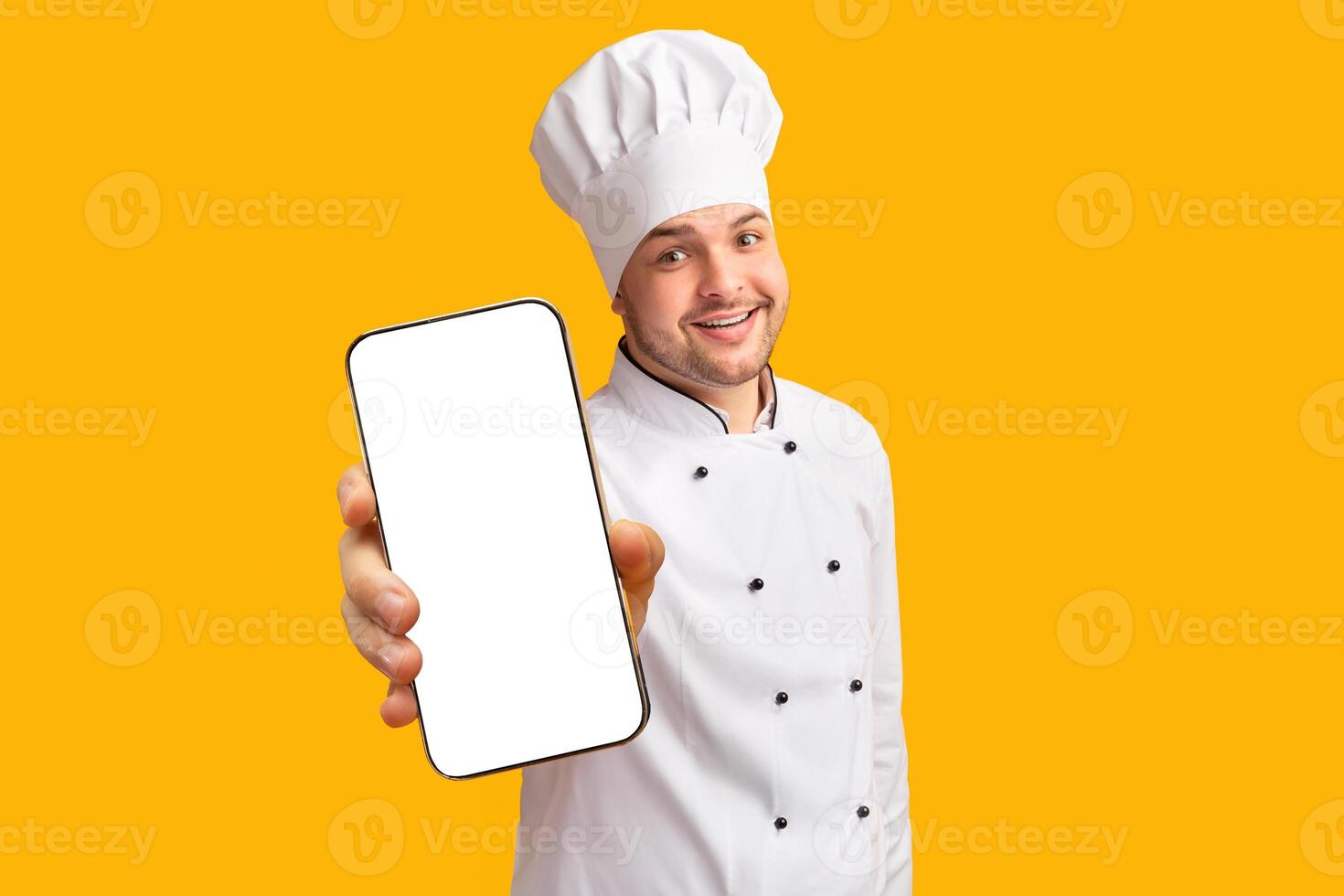Cheerful Chef Guy Holding Ladle Soup Spoon Posing Over Yellow Background. Cooking Food Concept. Studio Shot photo
