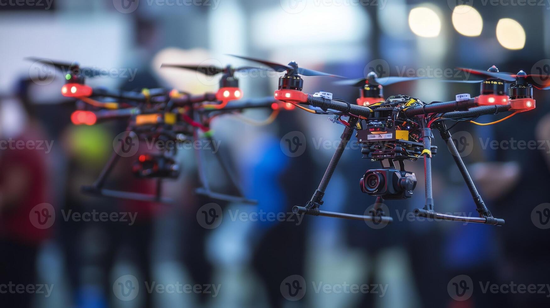 Drones equipped with cameras hover above a crowd at a technology exhibit, showcasing modern aerial capabilities. photo