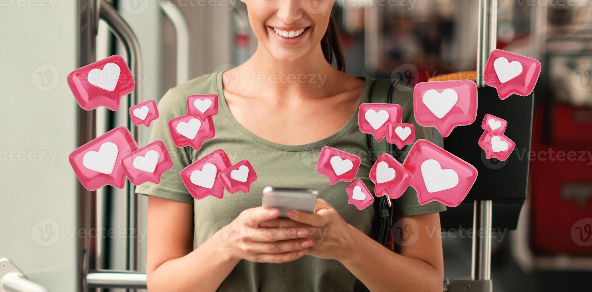 A woman smiles as she uses her smartphone on a public bus. Surrounding her are various heart icons in a pink hue, resembling social media notifications photo