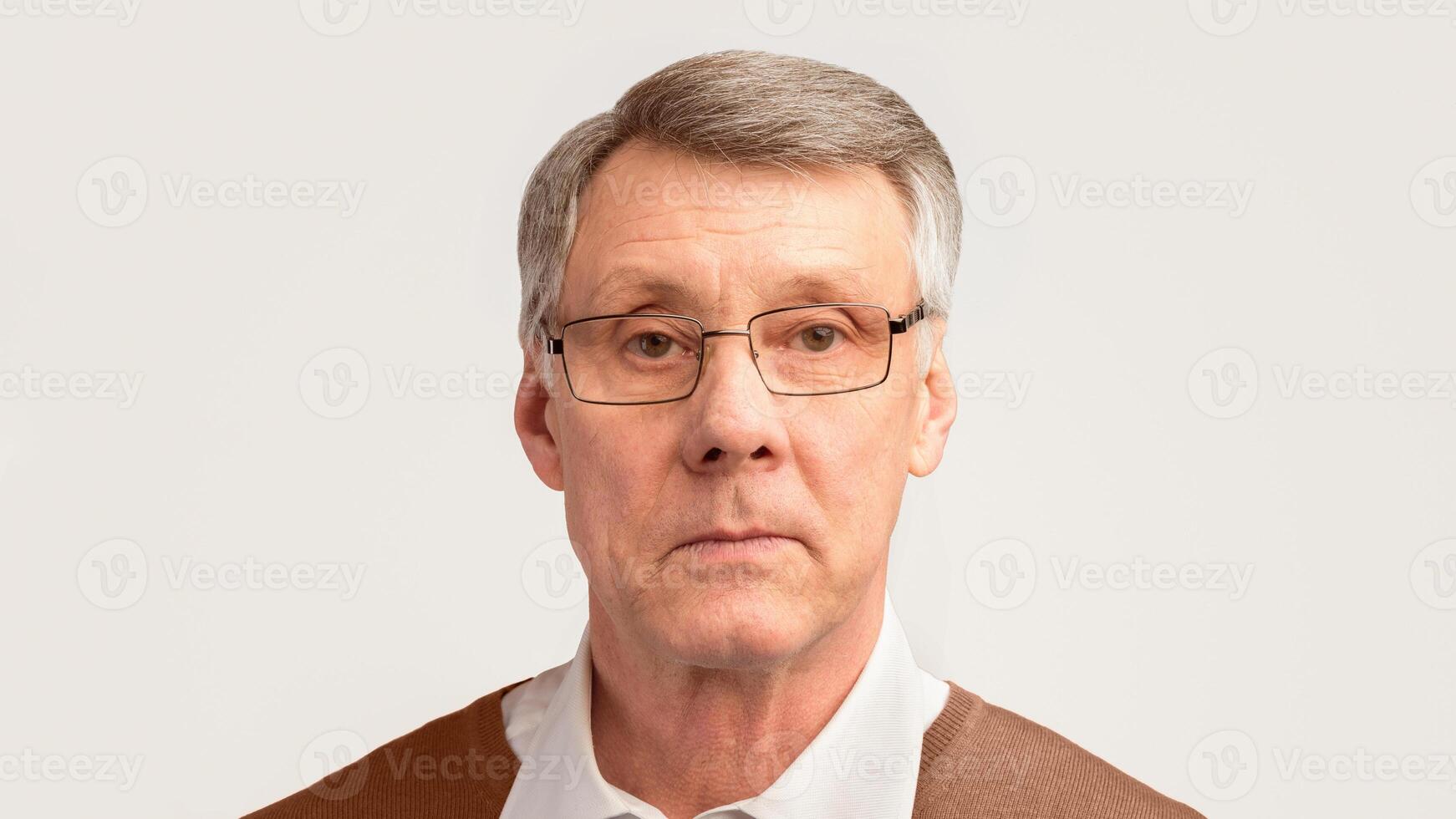 Senior Man Portrait. Serious Elderly Gentleman Looking At Camera Posing On Gray Studio Background. Panorama photo