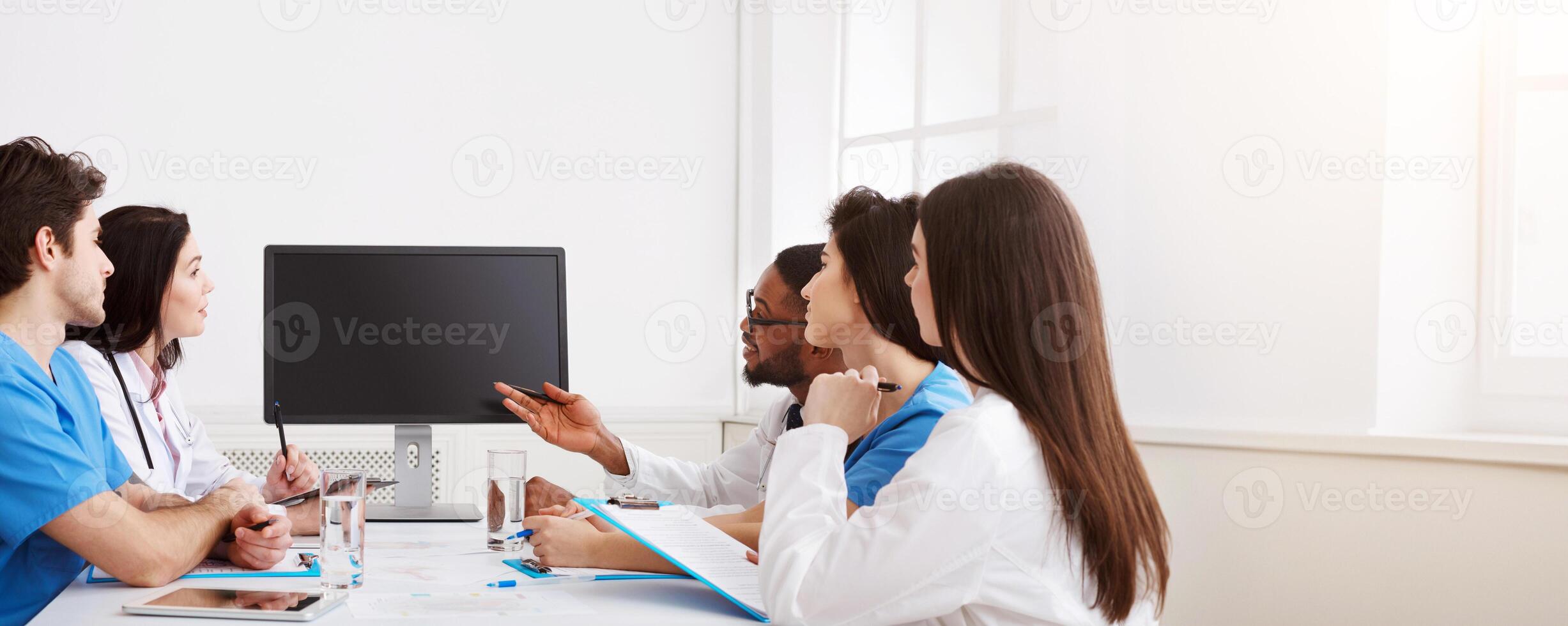 Remote Medicine. Team of Doctors Parsing Difficult Case From Patient By Link photo