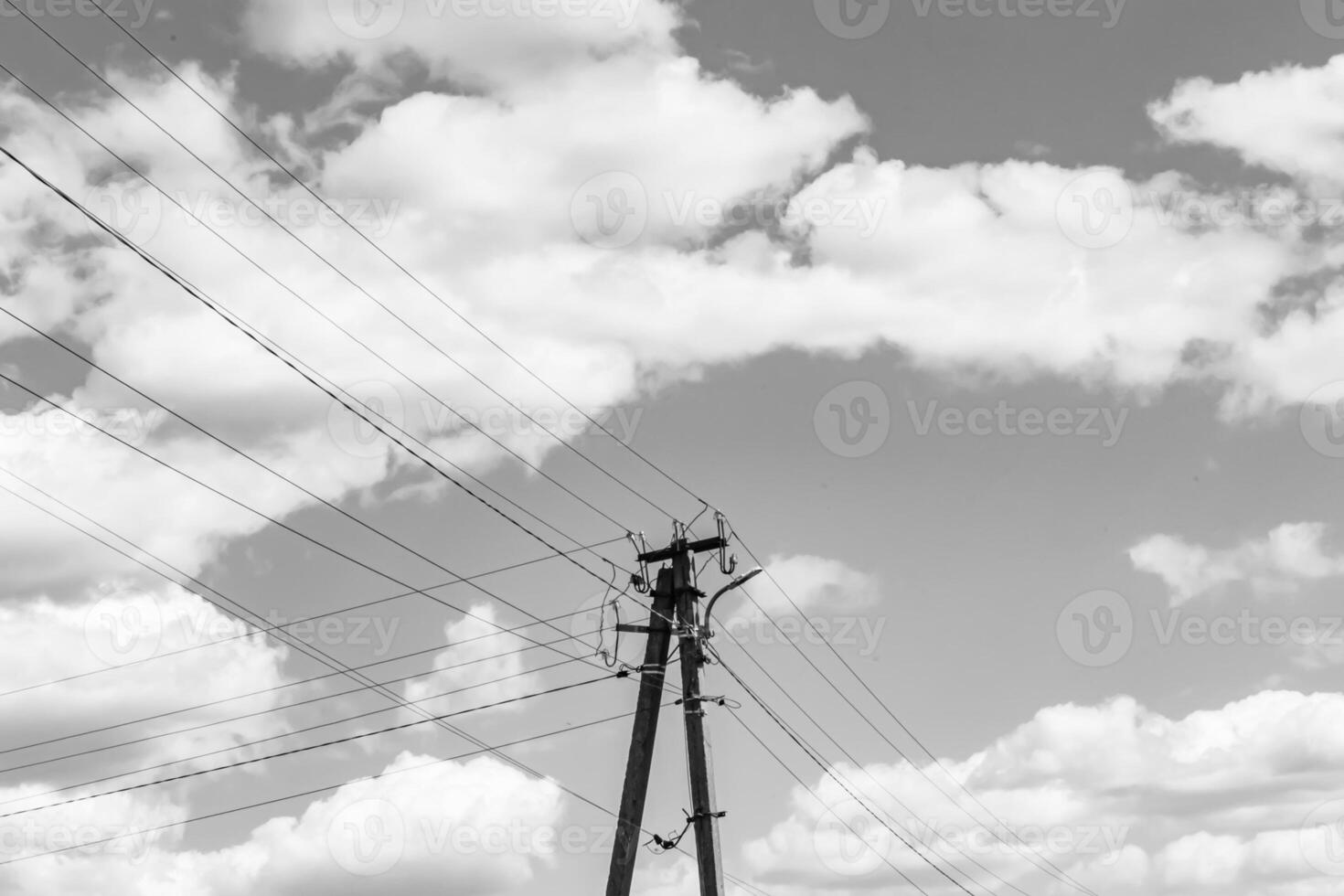 Power electric pole with line wire on light background close up photo