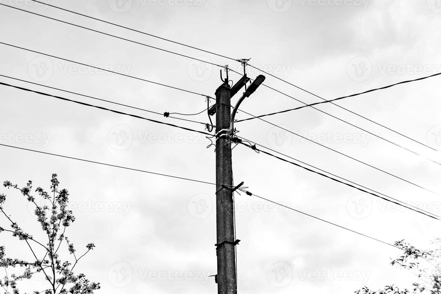 Power electric pole with line wire on dark background close up photo