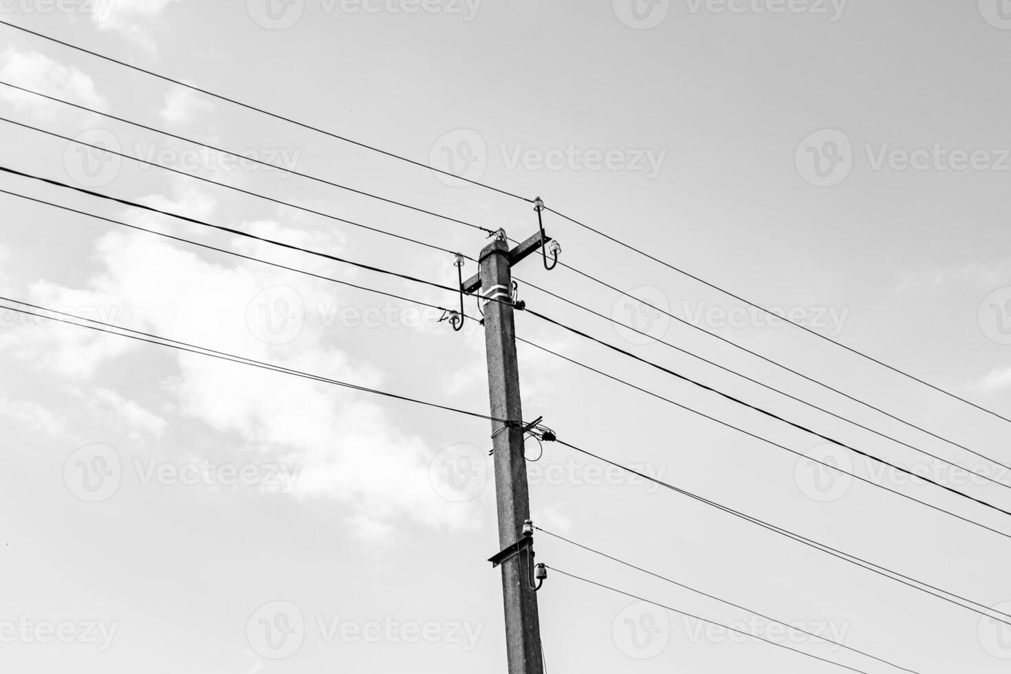 Power electric pole with line wire on dark background close up photo