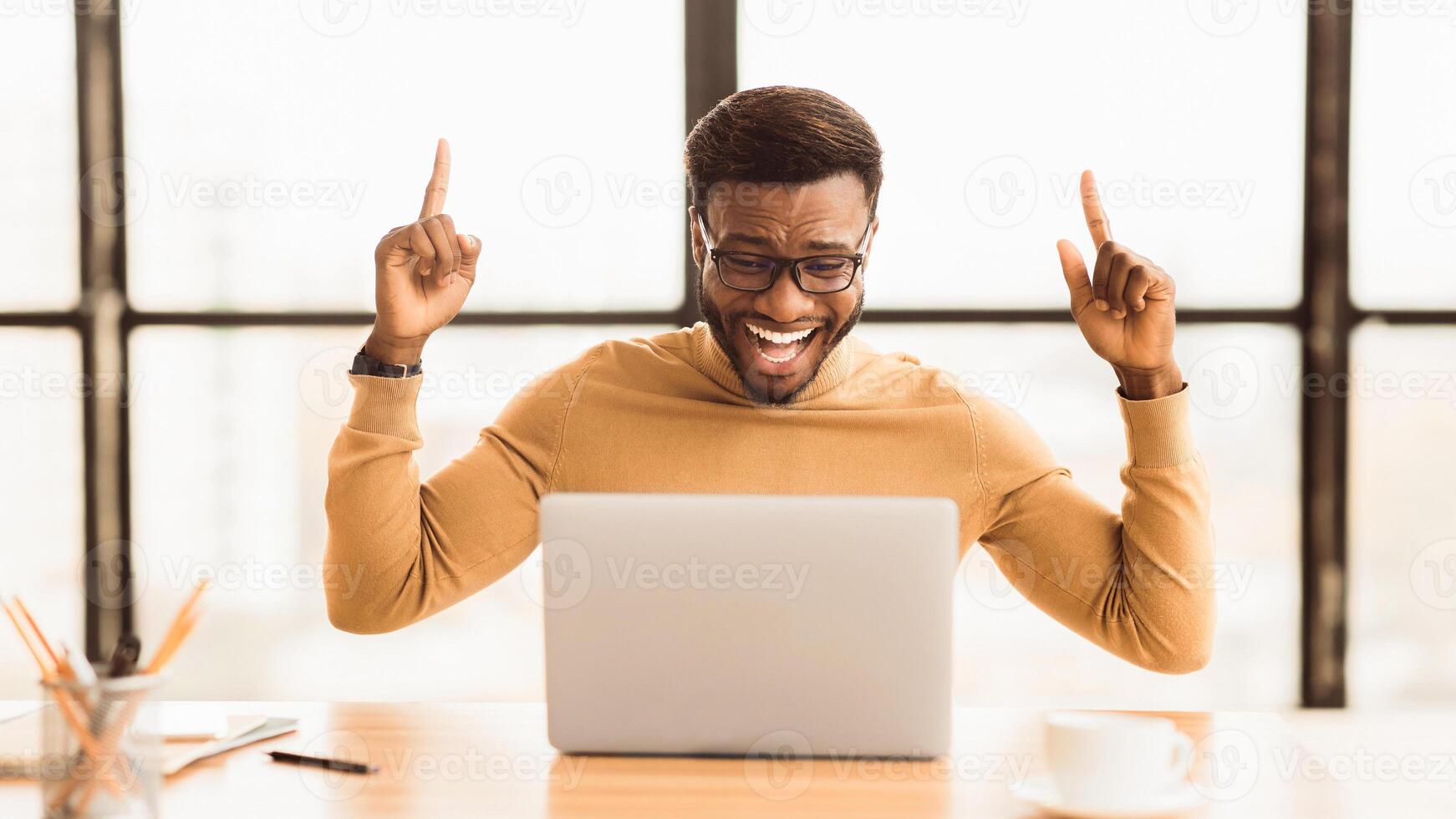 Hooray. Excited black businessman having excellent idea, finding solution to problem, fingers up, copyspace, panorama photo
