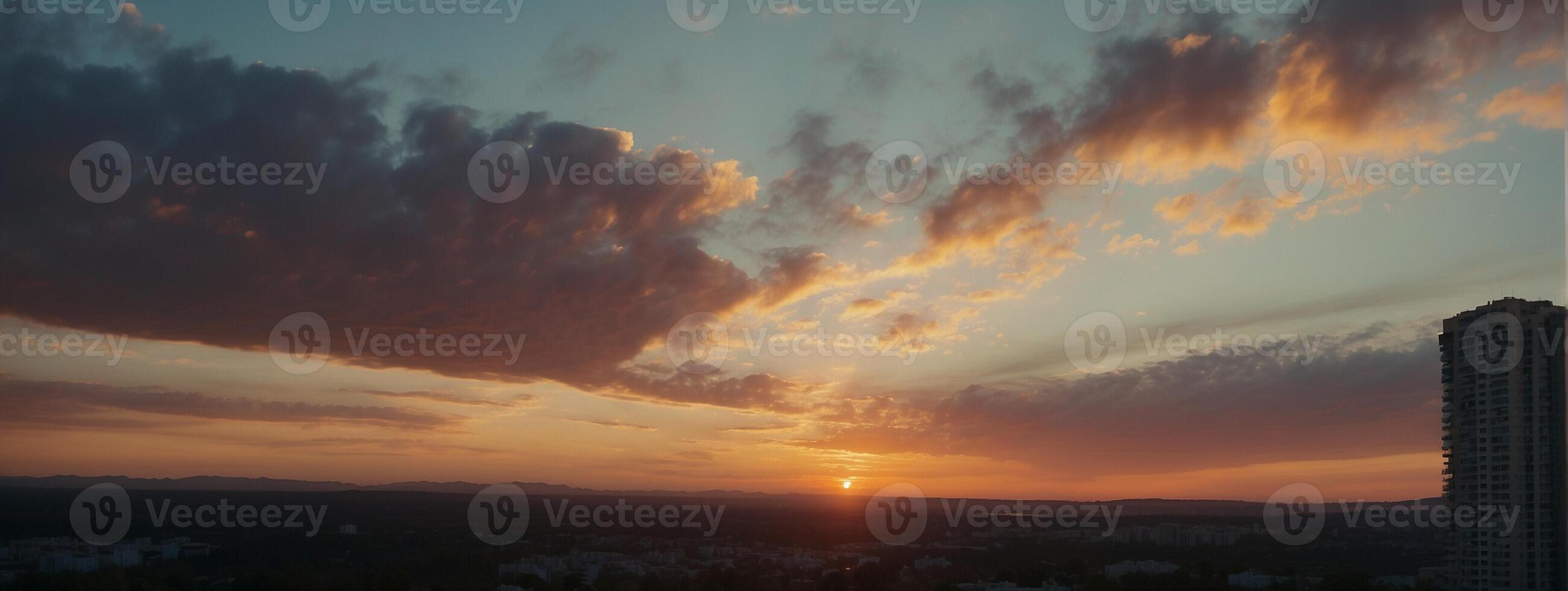 A sunset over a city with tall buildings photo