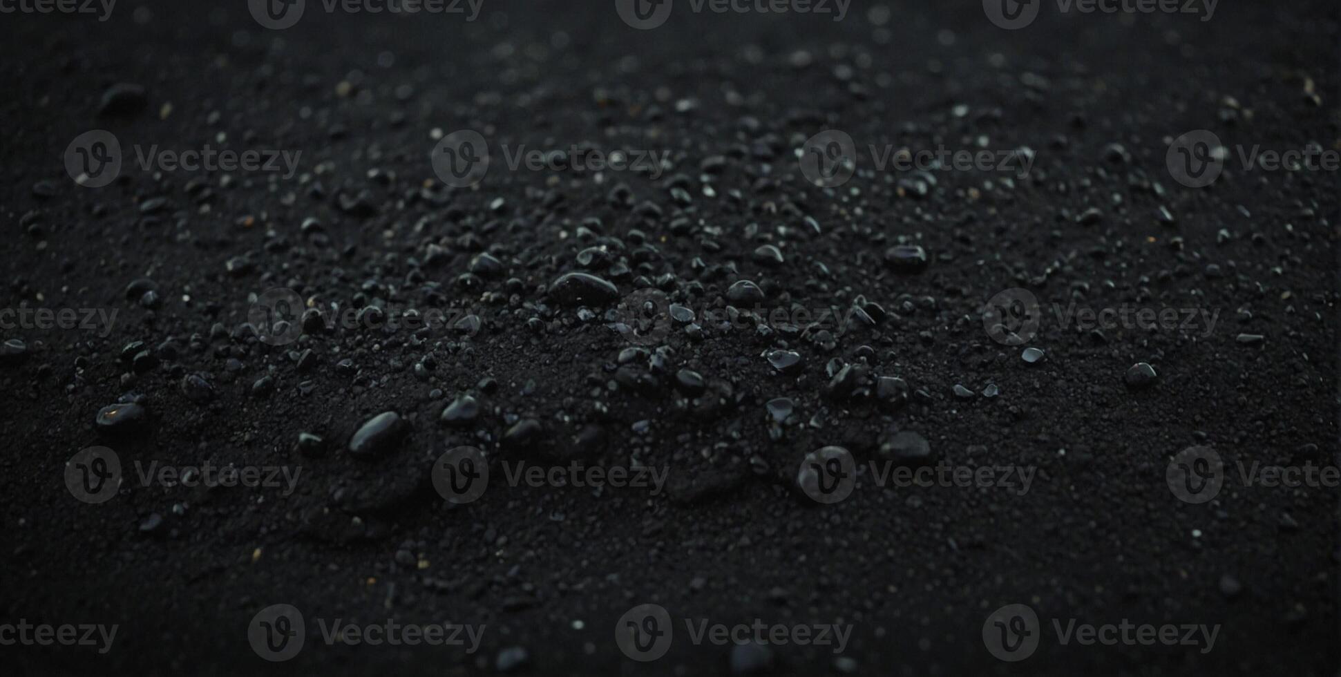 A close up of a black substance on a surface photo