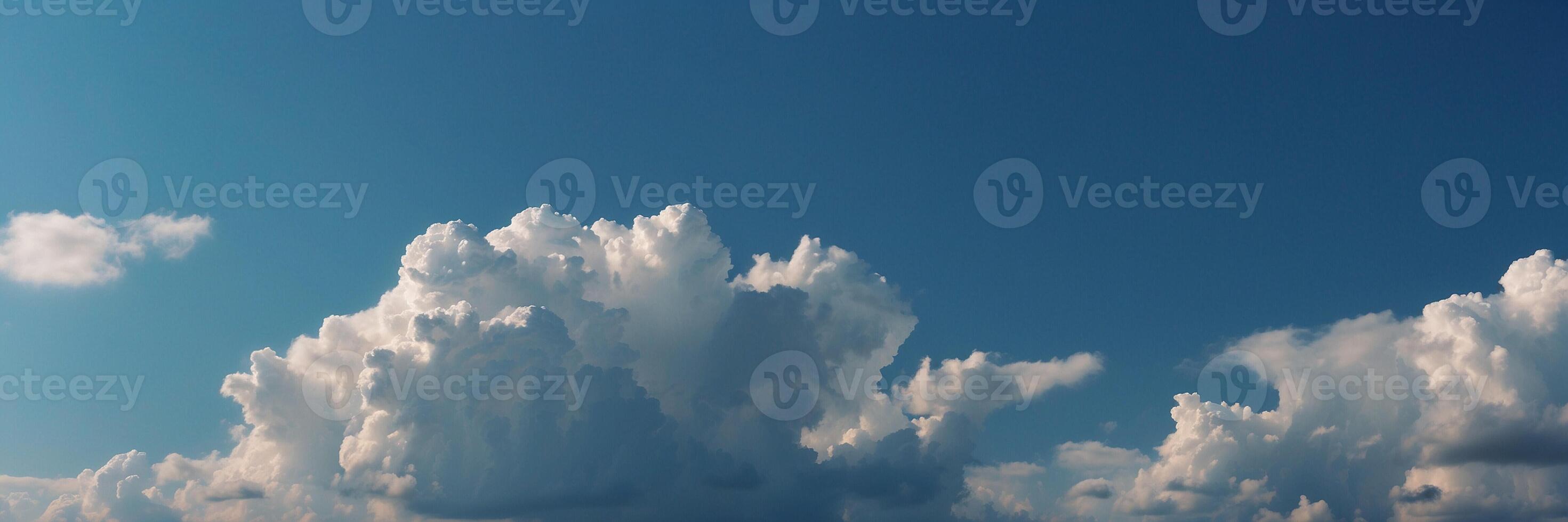 Clouds Towering Against a Serene Blue Sky on a Sunny Day photo