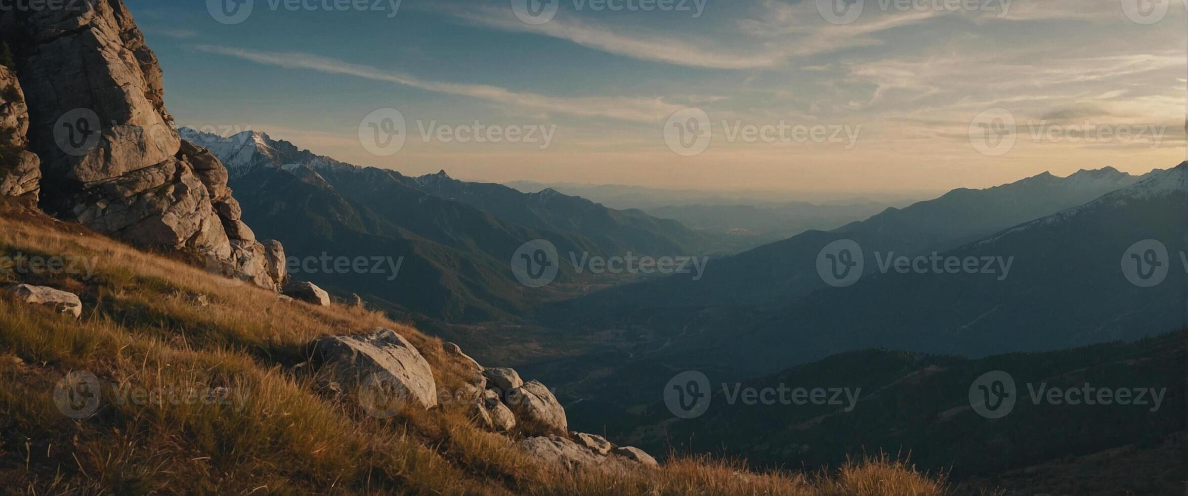 A mountain range with grass and rocks photo