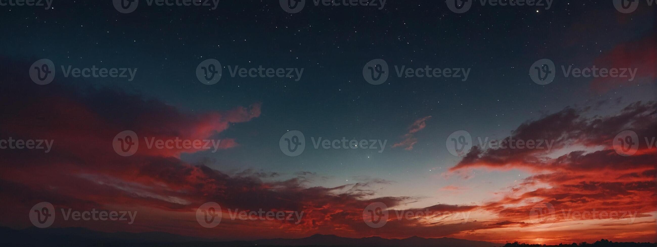 A red sky with clouds and stars photo