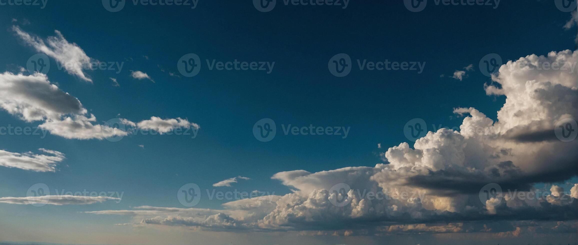 A view of the sky with clouds and a blue sky photo