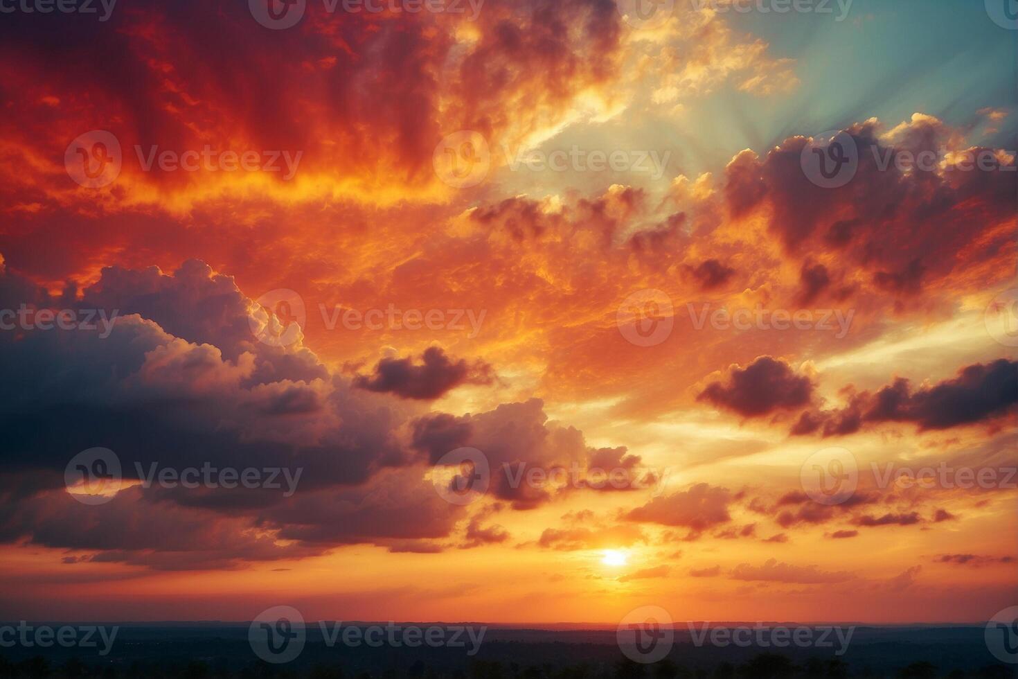 A sunset over a field with clouds photo
