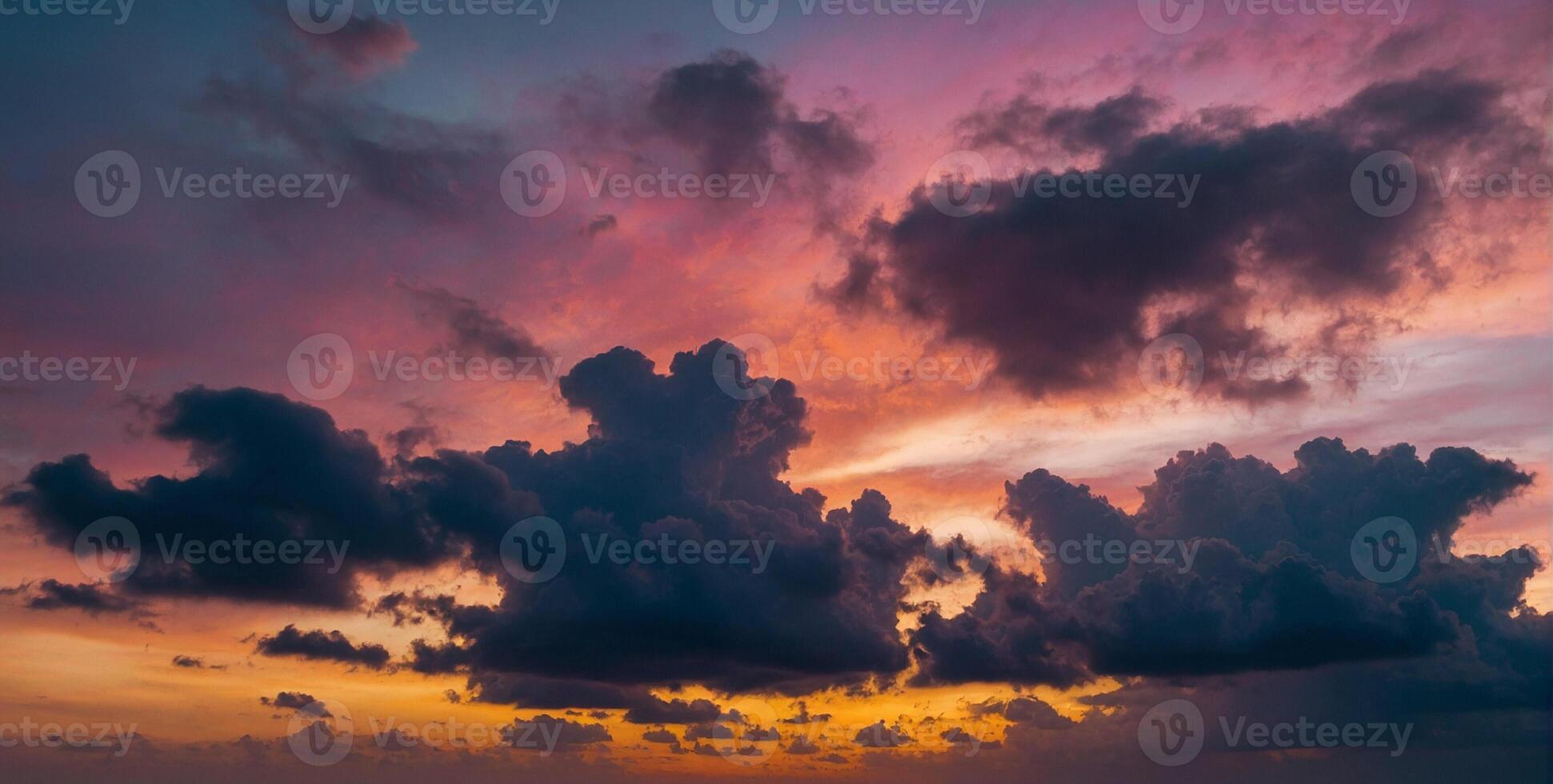 A colorful sunset over the ocean with clouds photo