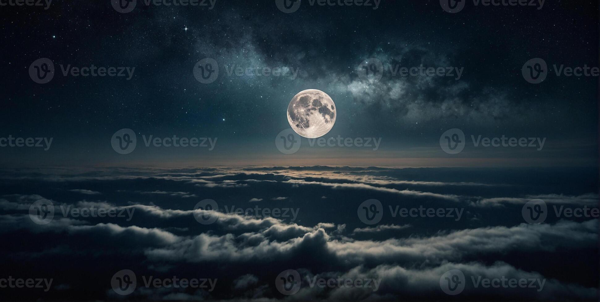 The moon is seen above clouds in the night sky photo