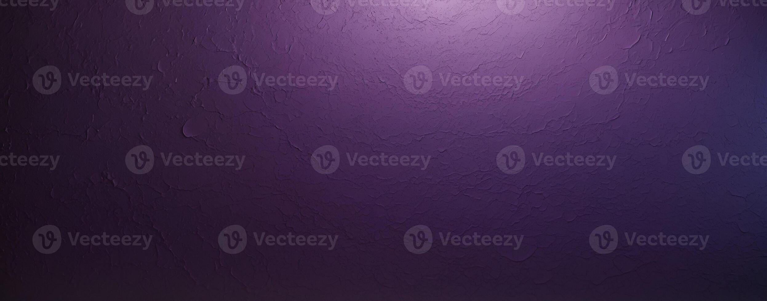 A purple wall with a light shining on it photo