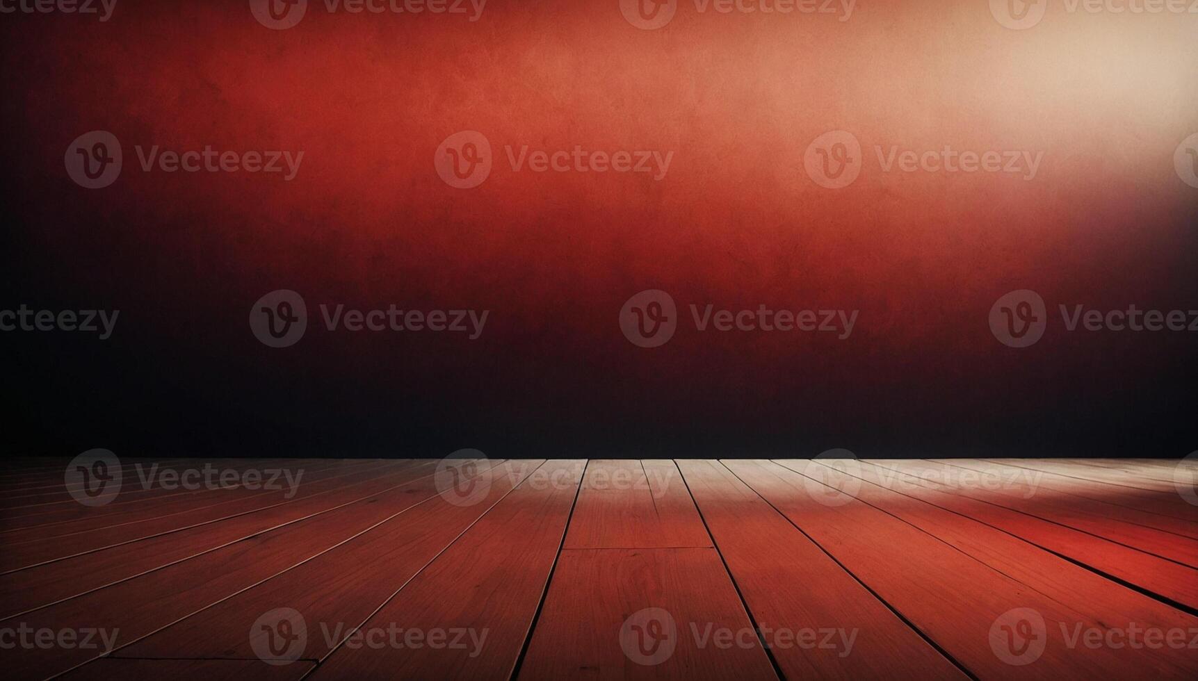 An empty room with a red wall and wooden floor photo