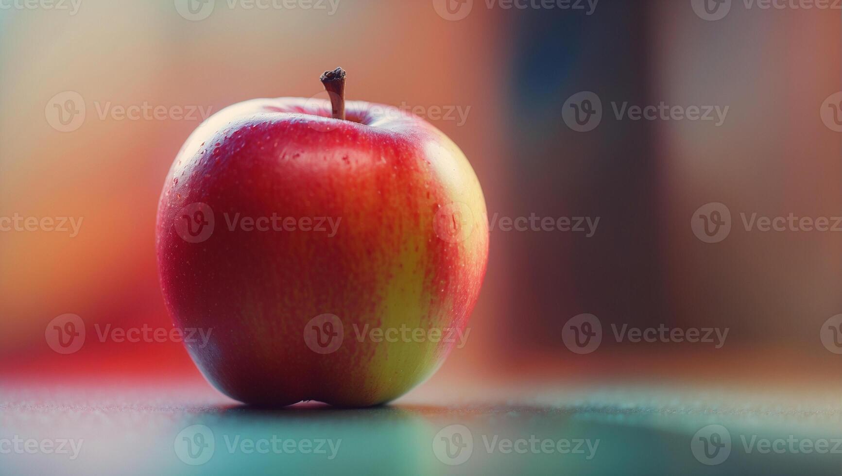 A red apple sitting on a table photo
