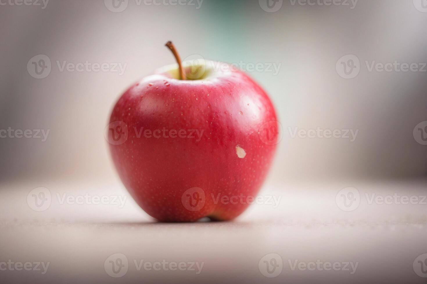 A red apple sitting on a table photo