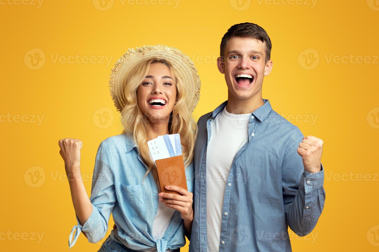 Happy couple holding passports with tickets celebrating getting a visa, ready for travel, panorama with free space photo