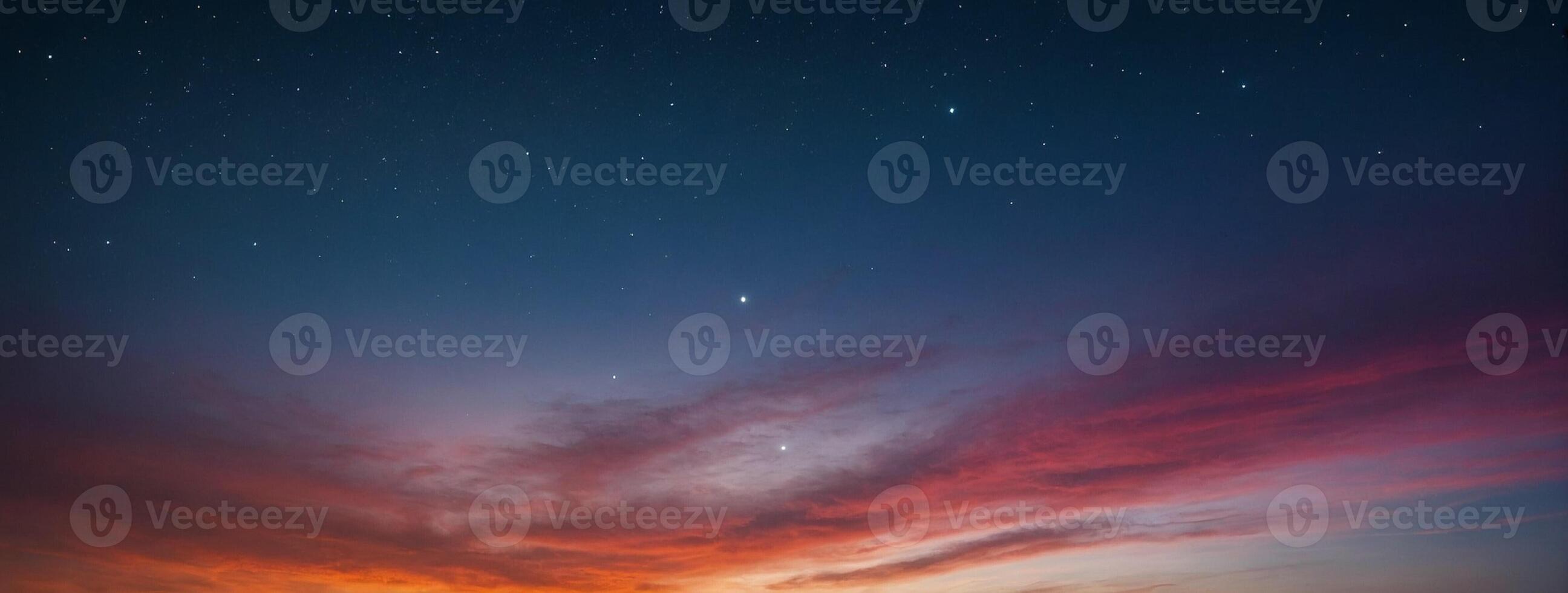 A colorful sunset over the ocean with a star in the sky photo