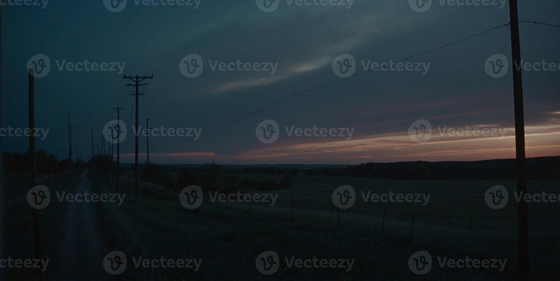 A dark sky with clouds and power lines photo