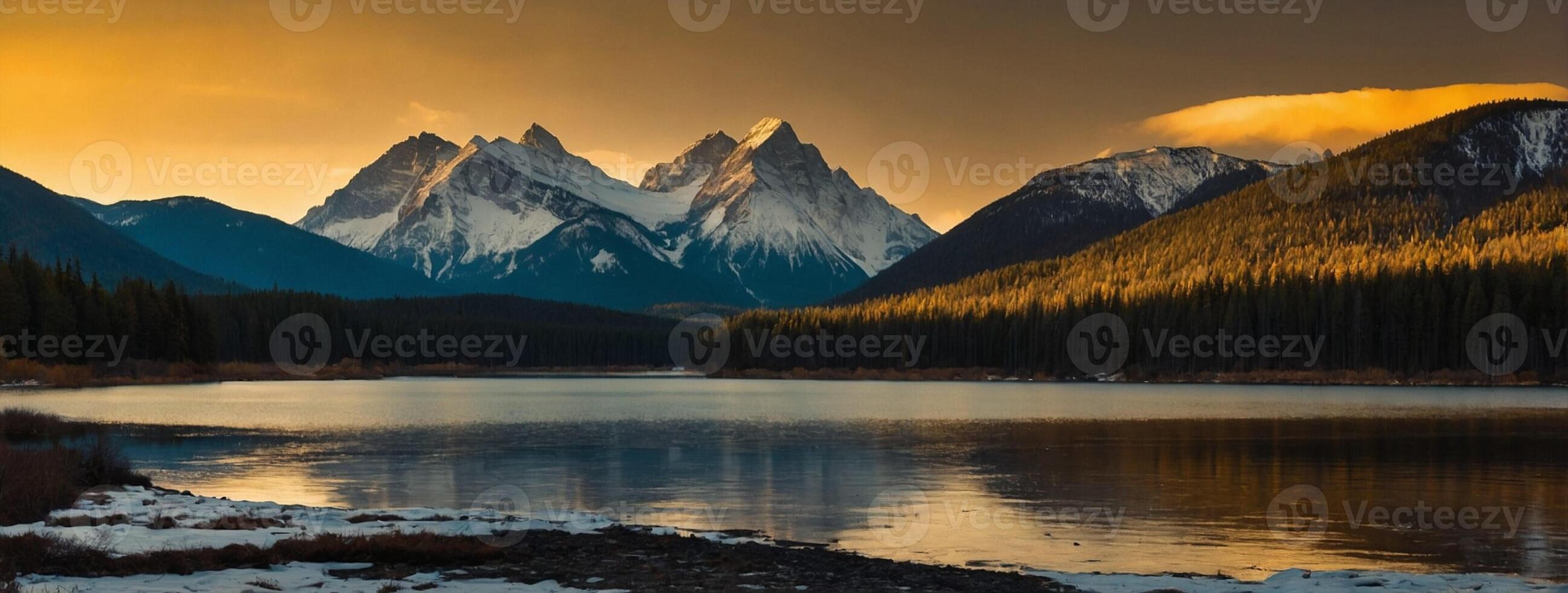 A lake and mountains at sunset photo