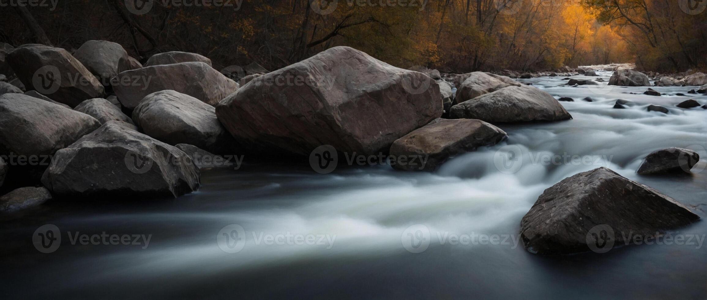 A river flowing through rocks with water and trees photo