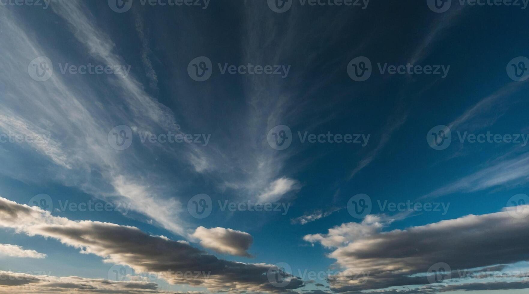 A view of the sky with clouds and a blue sky photo