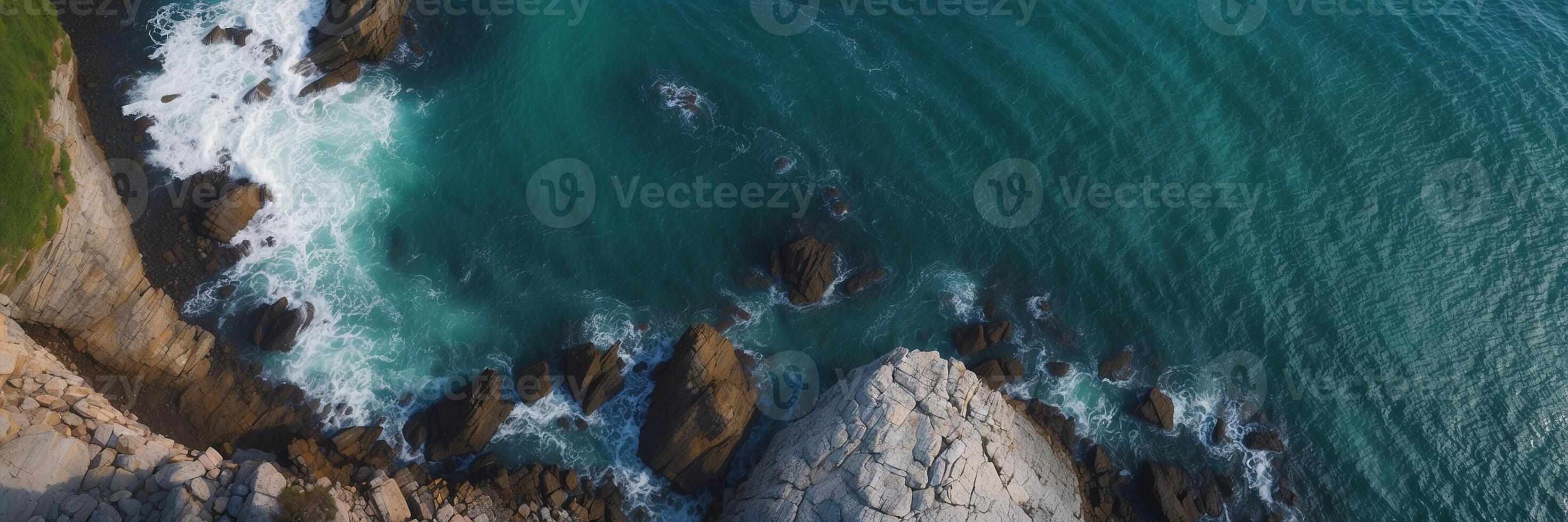 An aerial view of the ocean and rocks photo