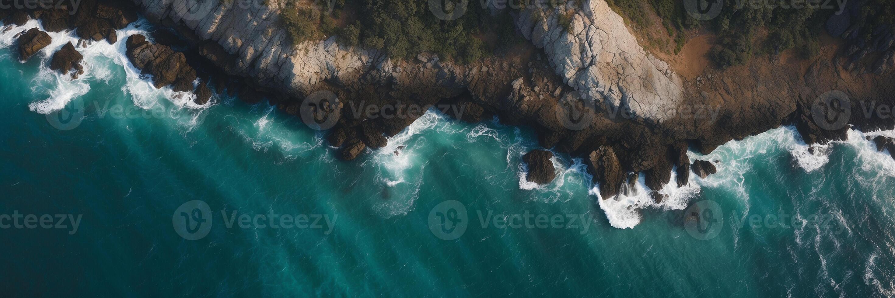 An aerial view of the ocean and cliffs photo