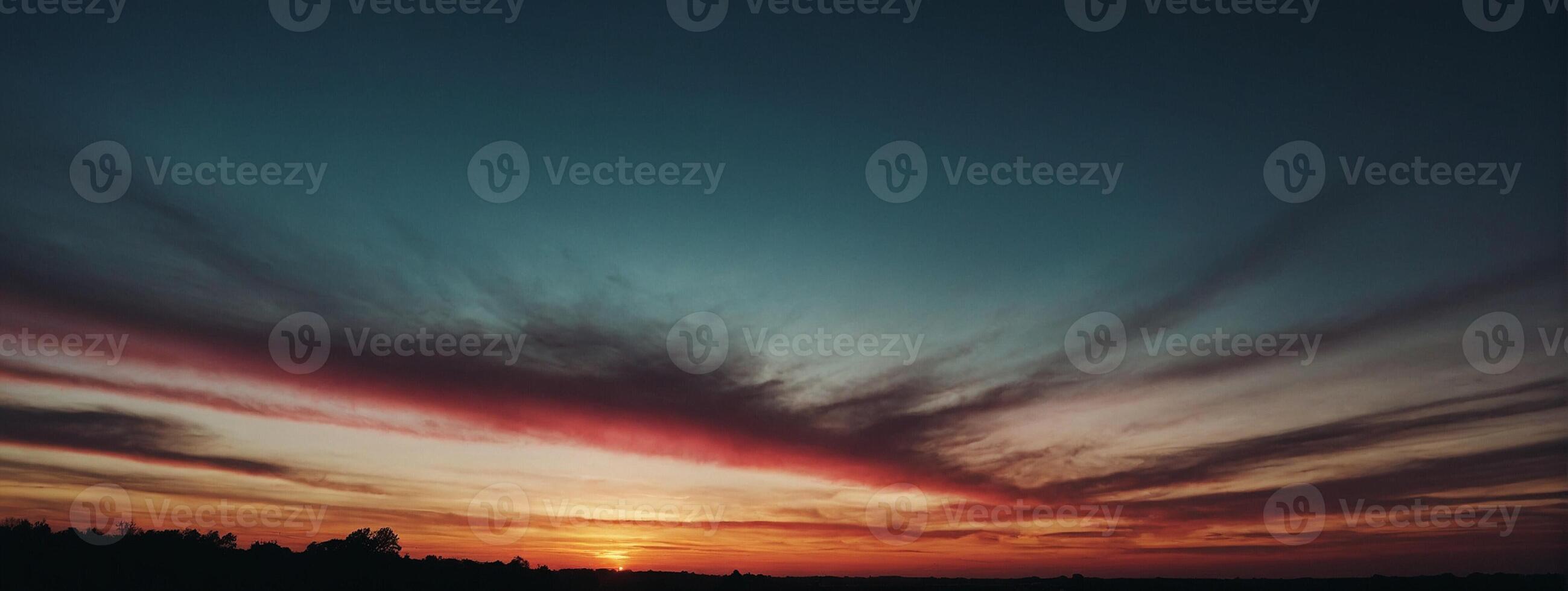 A sunset with clouds and a red sky photo