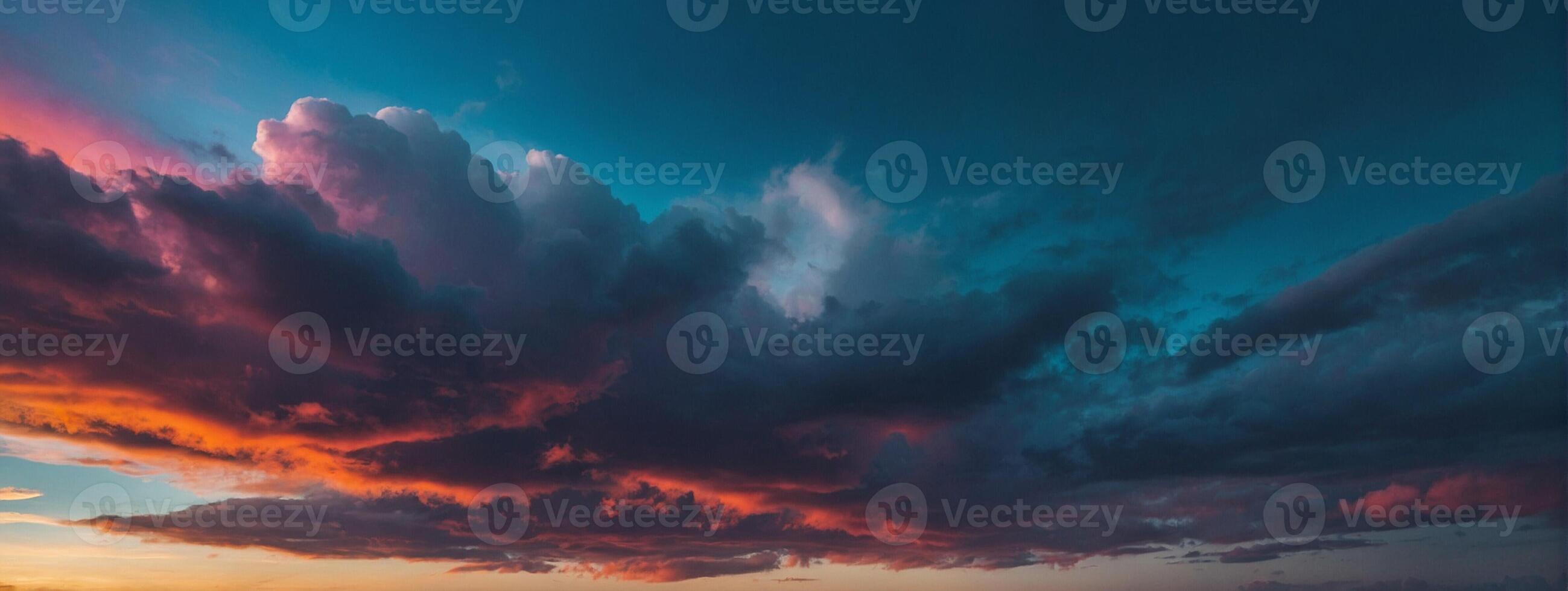 A colorful sunset over the ocean with clouds photo