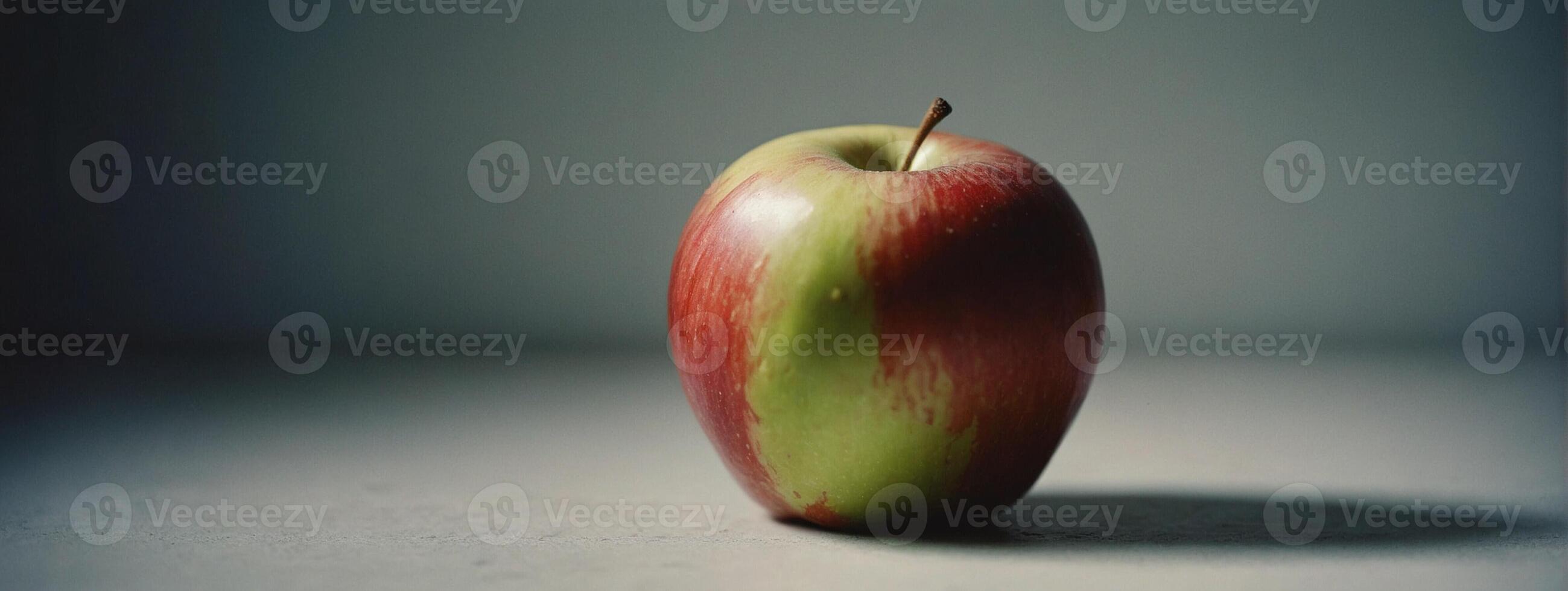 A red apple sitting on a table photo