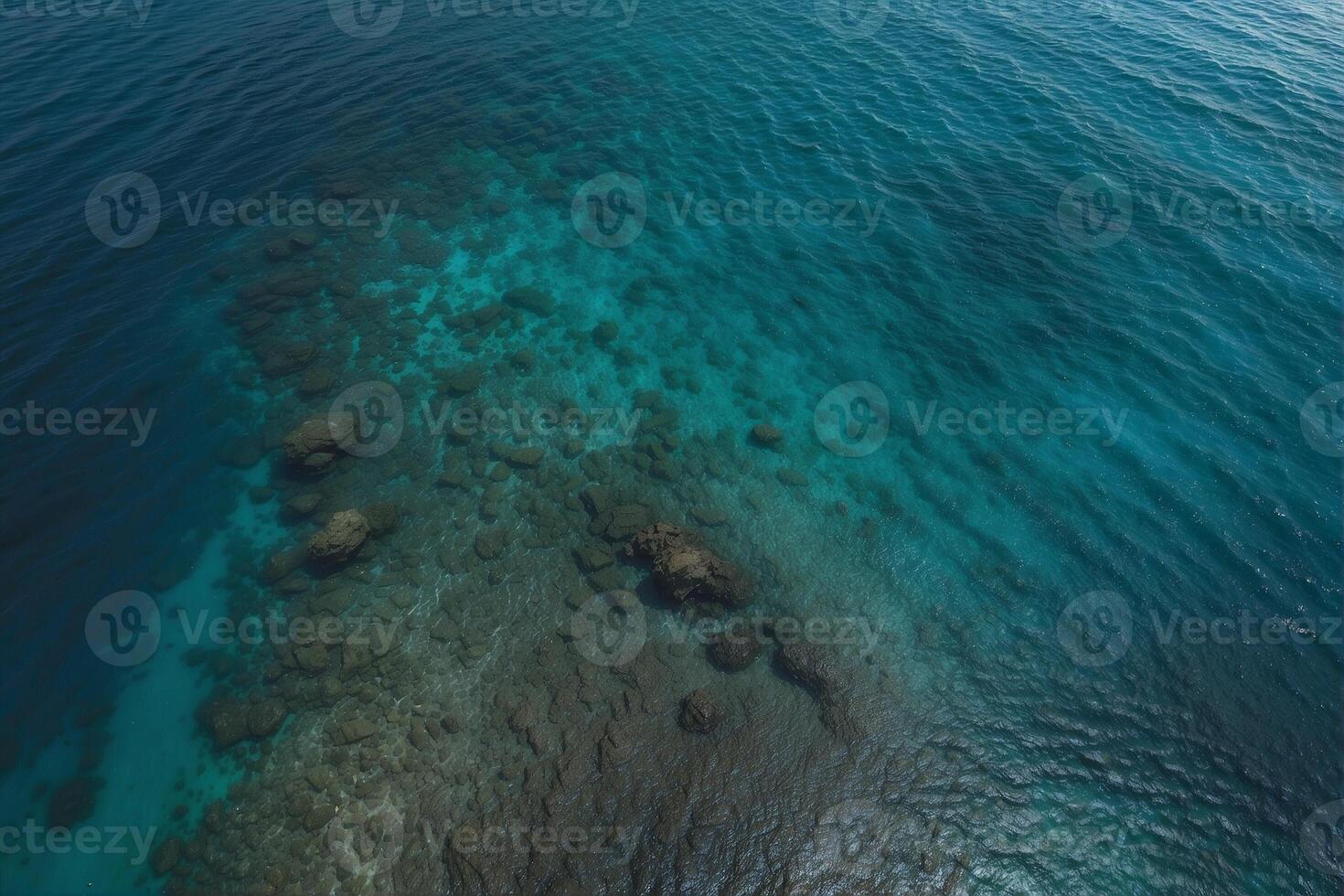An aerial view of the ocean and coral reefs photo
