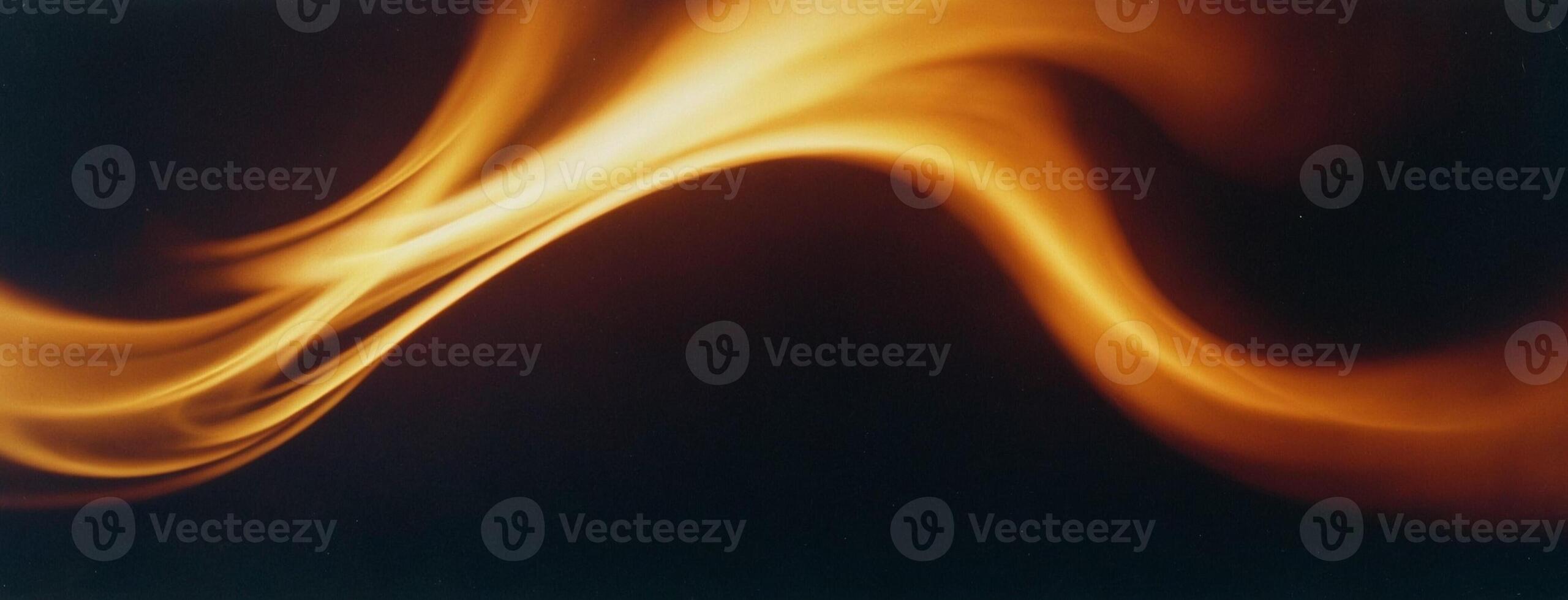 Blurry Yellow Fire on Black Background photo