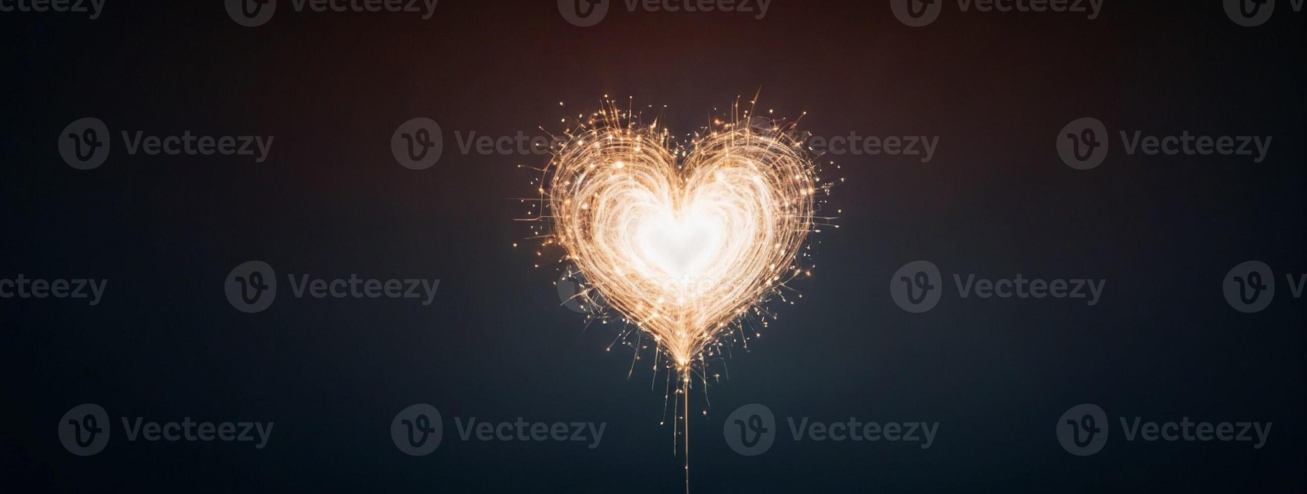 A sparkler is shown in the shape of a heart photo