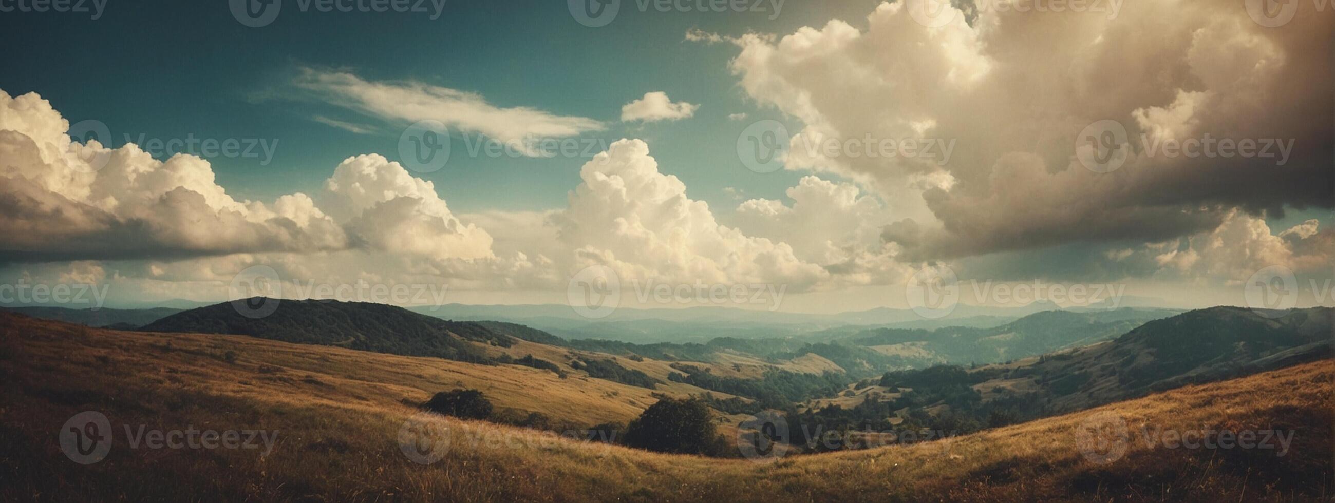 A view of the mountains and clouds over the valley photo