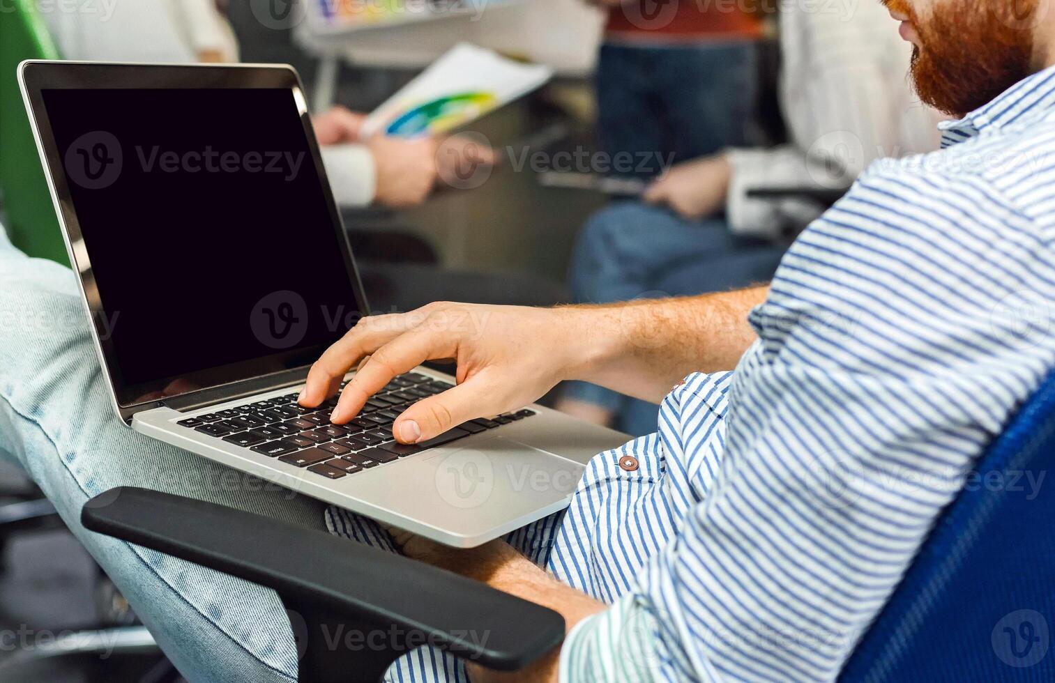 Analyzing finances of business. Self-employed entrepreneur working on laptop with blank screen, panorama photo