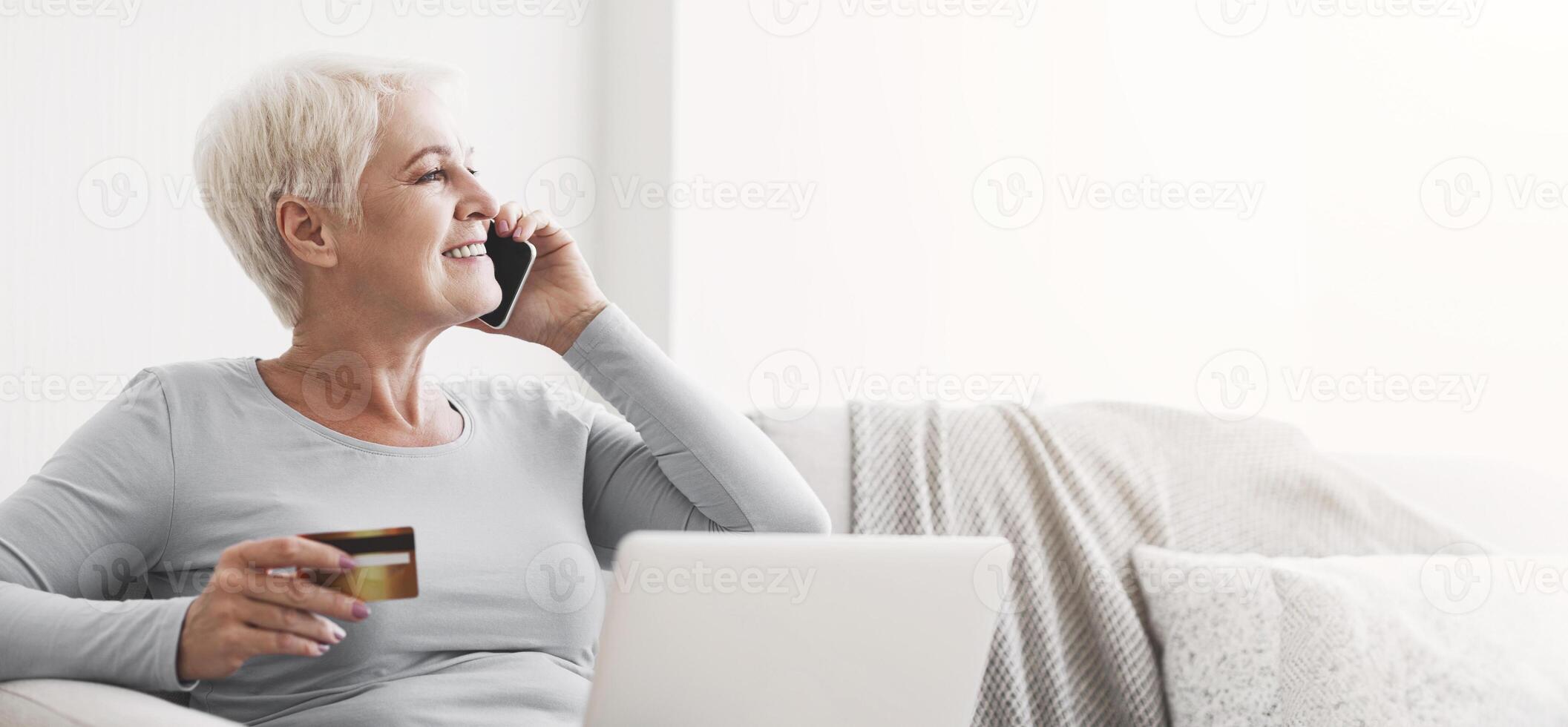Retired lady learning how to make shopping online, talking to customer support, home interior, copy space photo