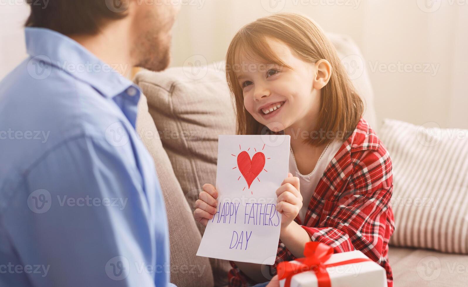 Close up of adorable daughter greeting her daddy with Father Day, happy moments photo