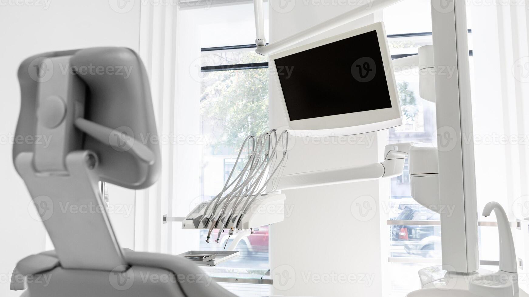 Shot of empty modern dentist workstation in dental cabinet photo
