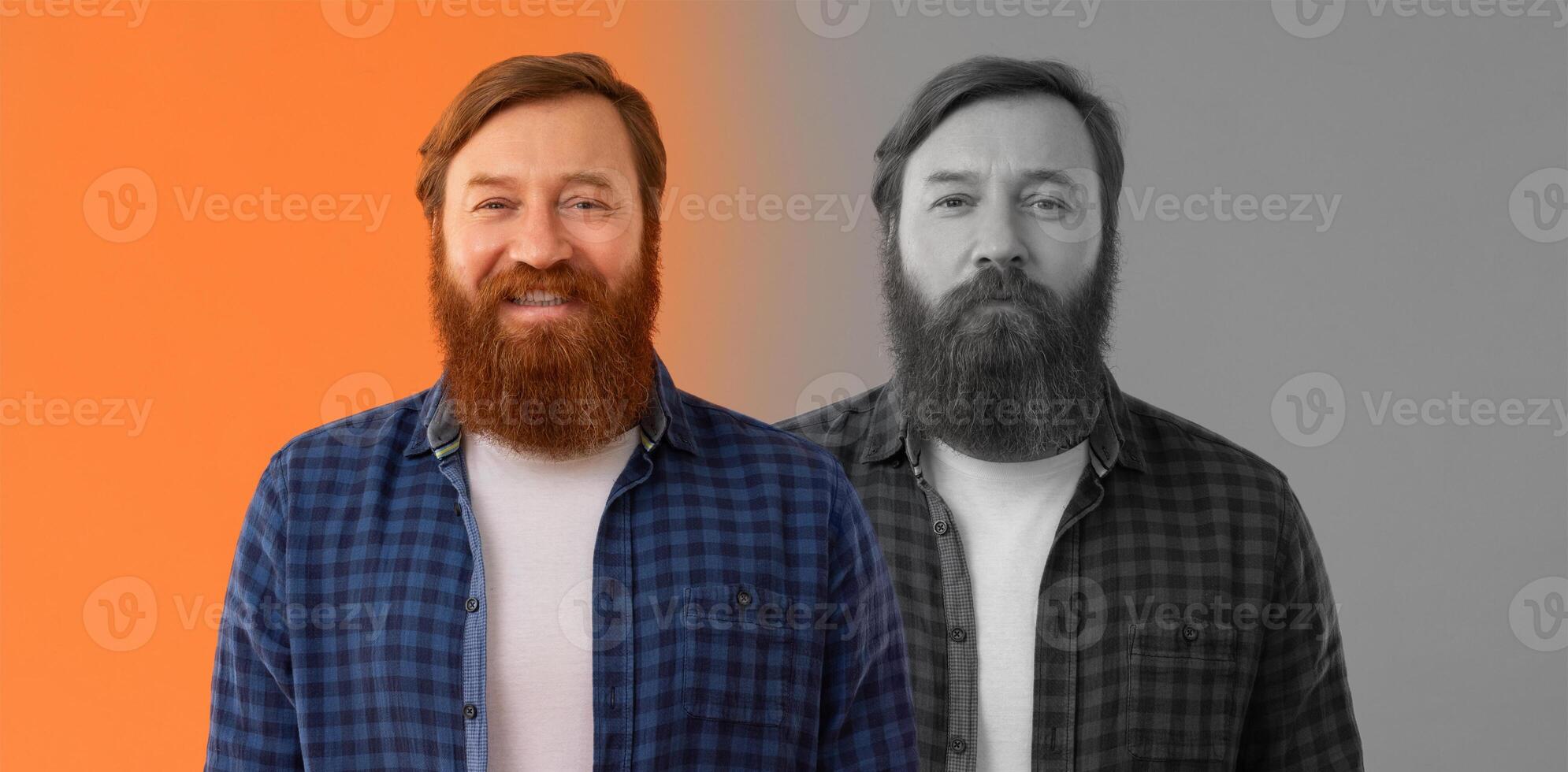 A man stands confidently, showcasing his full beard. He is dressed casually in a checkered shirt and white t-shirt, set against a vibrant orange and monochrome background that enhances his emotions photo