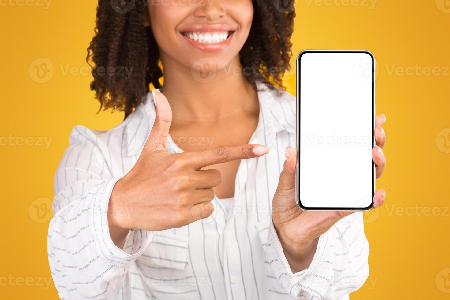 Awesome Application Or Website. Black woman showing blank cellphone screen for advertising text, empty space photo