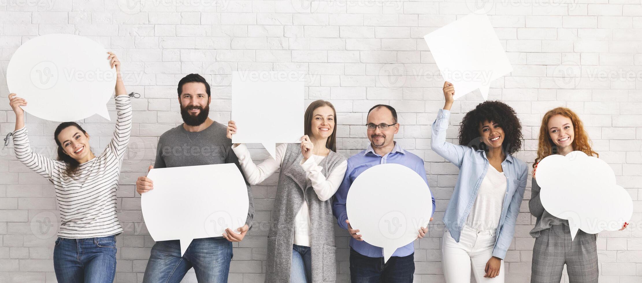 Everyone has own opinion. Group of millennial people holding empty white speech bubbles, free space photo