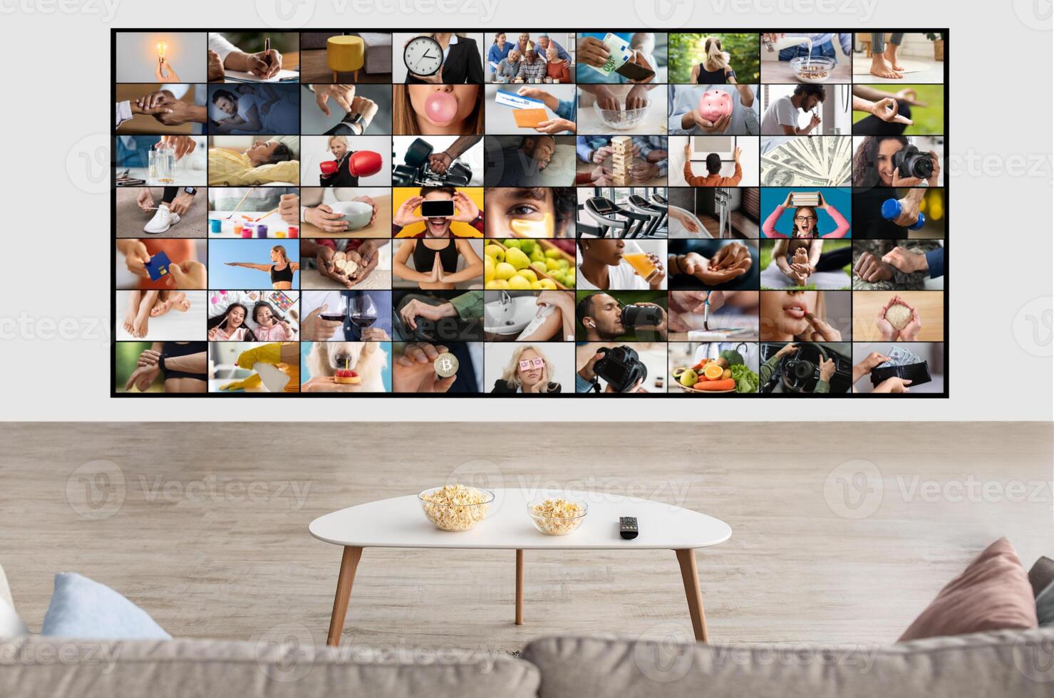 A modern living room featuring a large screen displaying a diverse collage of images. The screen is mounted on a white wall, showcasing various scenes of people engaged in everyday activities. photo