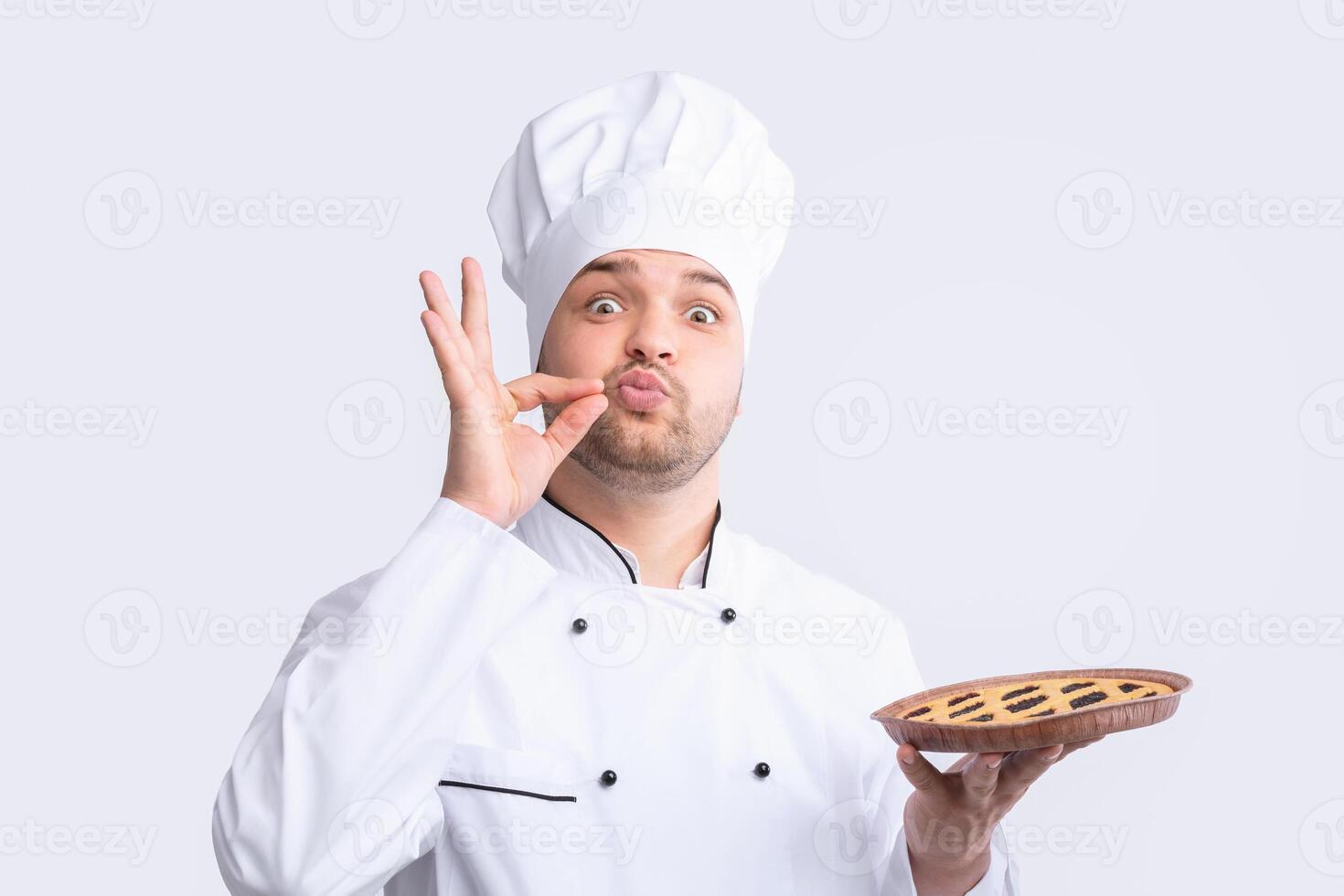 Secret Recipes. Chef Guy Holding Pie Doing Zip Your Lip Gesture Posing Over White Background. Studio Shot, Panorama photo